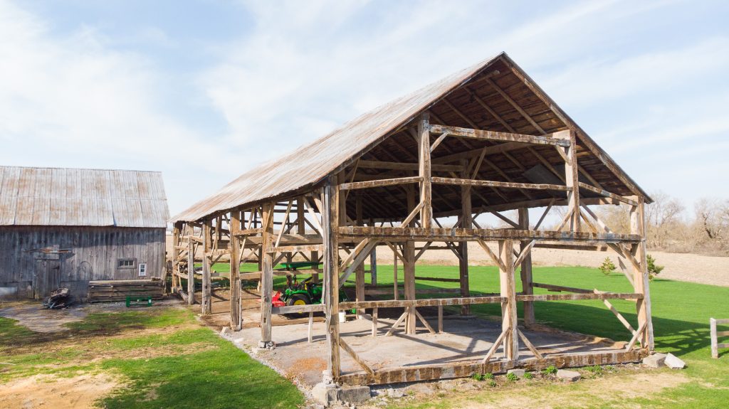 A ground shot of an old barn before restoration in Carp